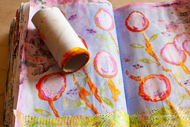 a book containing water color pictures painted with a TP roll tube