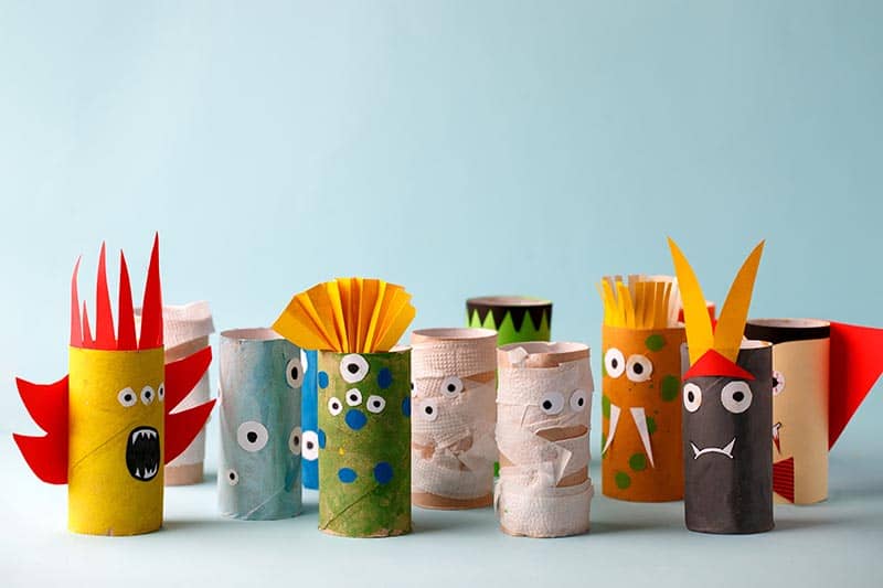 image of various monsters made out of toilet paper rolls. They have eyes and sharp teeth in a variety of ways.