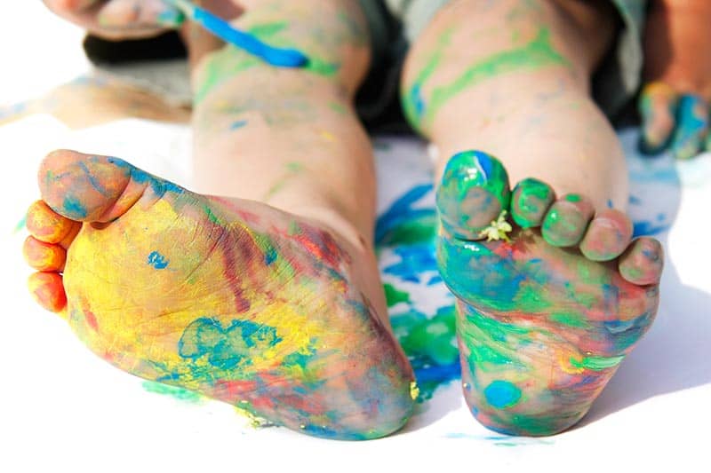 image of the bottom of a kid's feet, painted